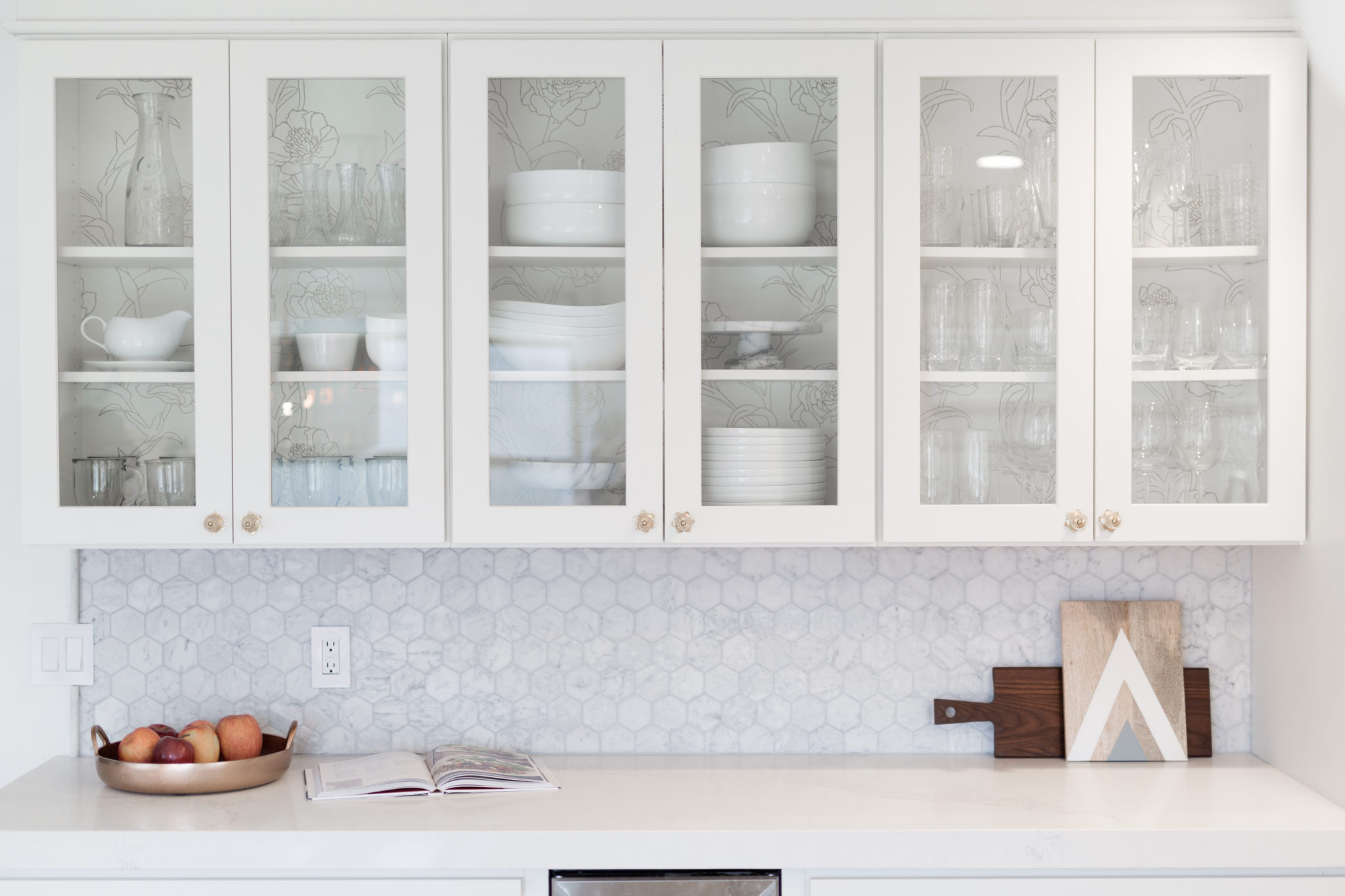 how to add temporary wallpaper to your open kitchen cabinets with tempaper designs on allweareblog.com | midcentury modern kitchen | all white kitchen | peony wallpaper | gold and brass kitchen